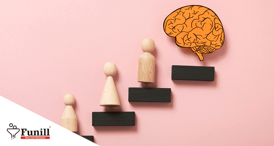Um grupo de figuras de madeira em frente a um cérebro de papel